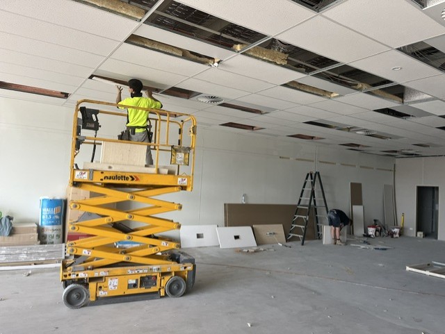 Caremore Pharmacy — During · ceiling installation