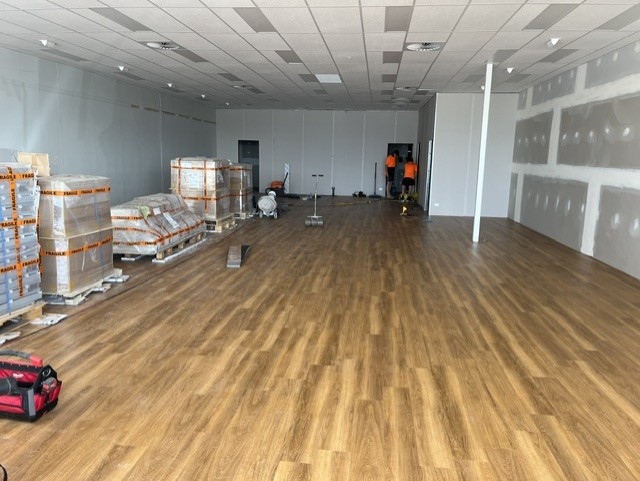 Caremore Pharmacy — During · commercial flooring installation