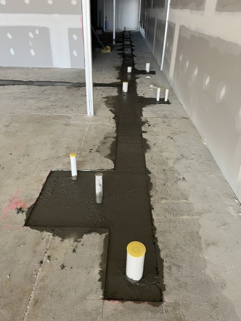 Caremore Pharmacy — During · plumbing and slab reinstatement