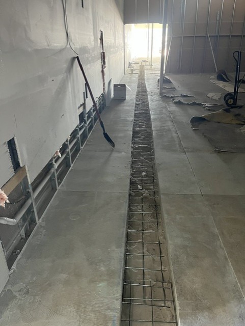 Caremore Pharmacy — During · slab trench and reinforcement