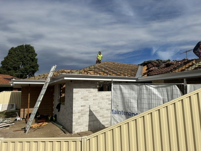 Front-of-House Extension — Extension roof tied into the existing home