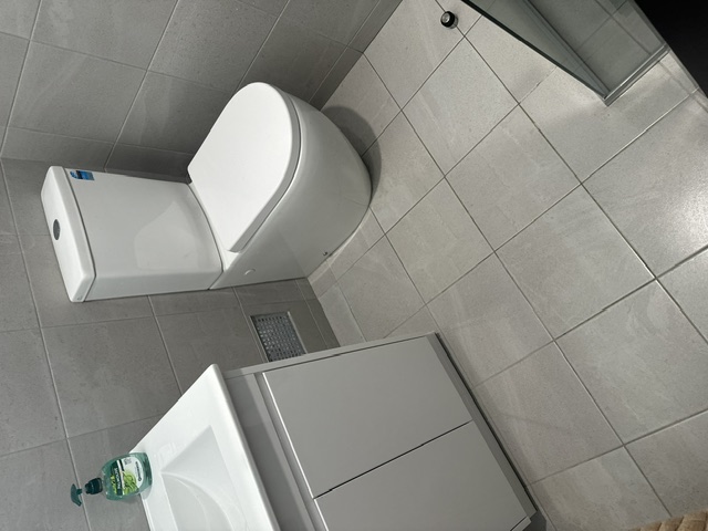 Residential Bathroom — After · new tiling and fixtures