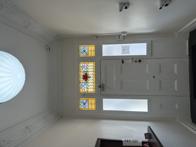 Swiss Family Clinic — Original stained glass and entry